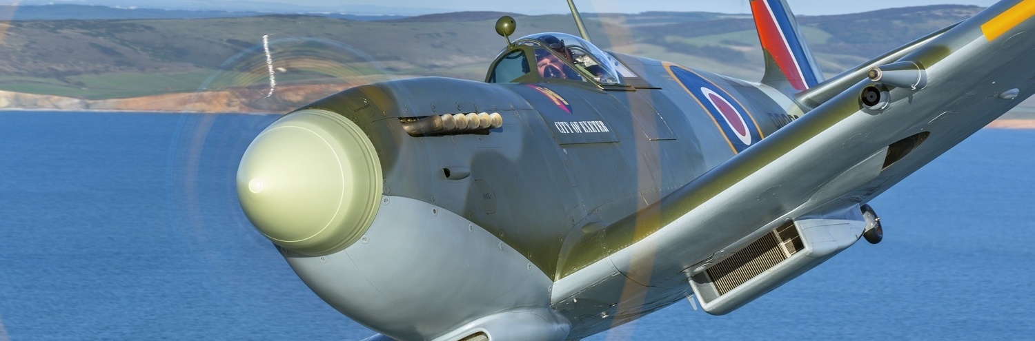 Spitfire flying over the sea